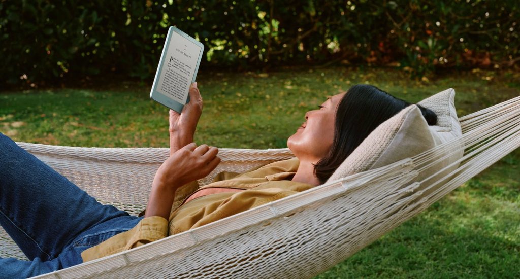 kindle paperwhite 2026 girl in garden reading